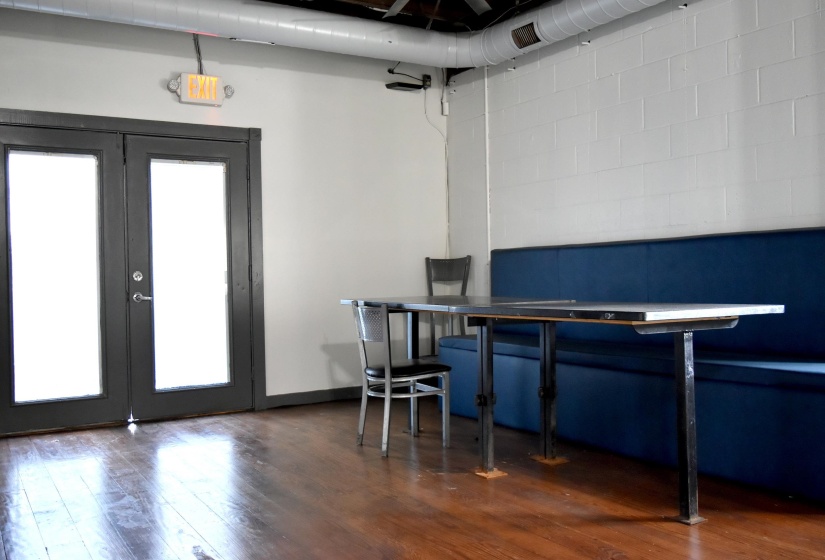 Office featuring dark hardwood / wood-style flooring and french doors