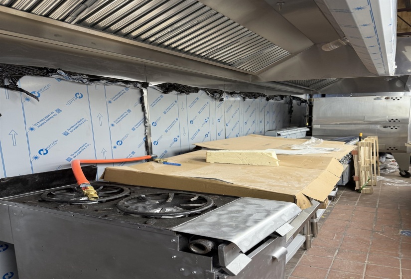 Interior space featuring dark tile patterned floors