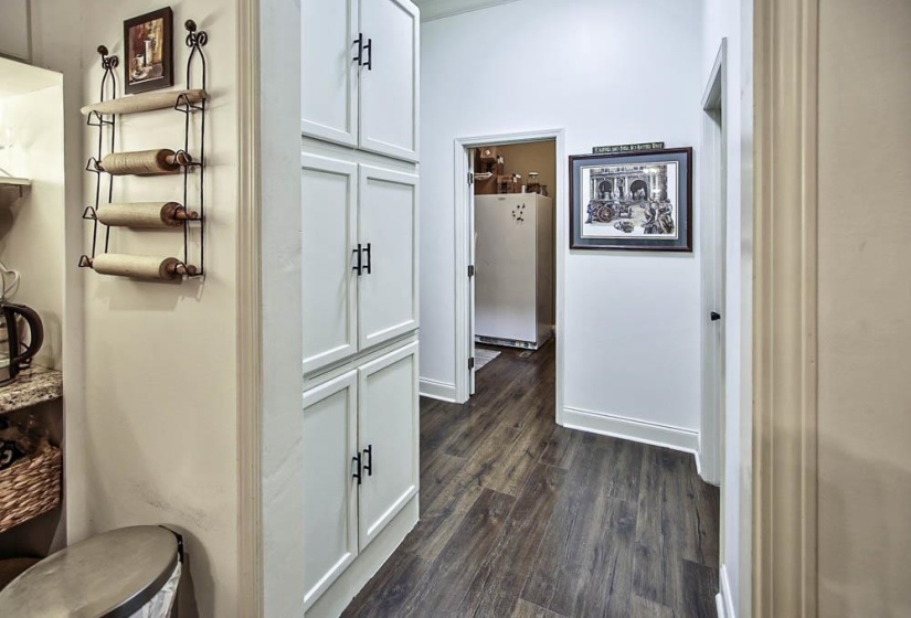 Hallway with dark wood-type flooring