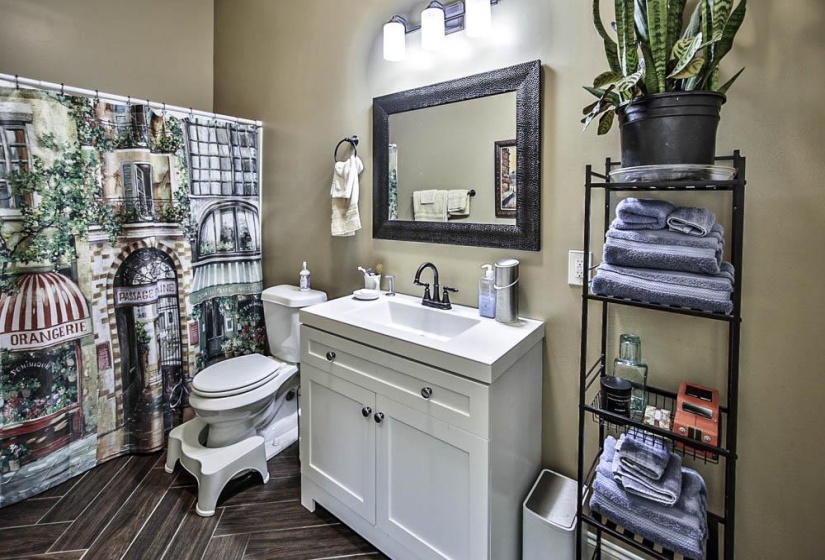 Bathroom featuring vanity and toilet