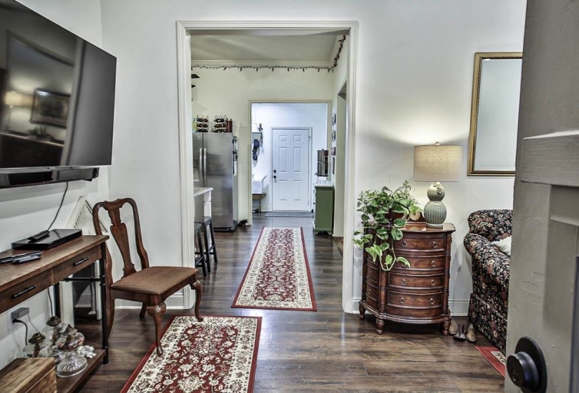 Foyer with dark hardwood / wood-style flooring