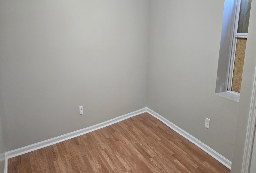 Empty room featuring hardwood / wood-style floors