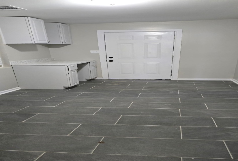 Kitchen featuring white cabinets