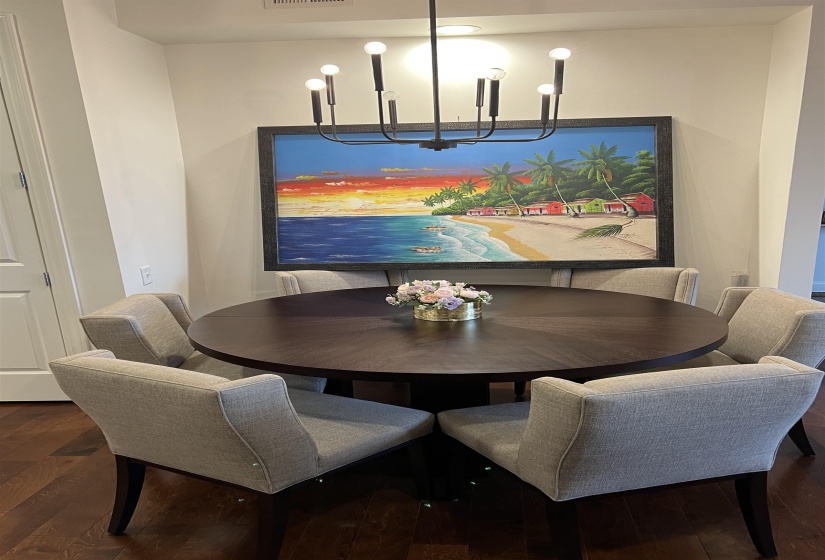 Dining space featuring hardwood / wood-style flooring and a notable chandelier