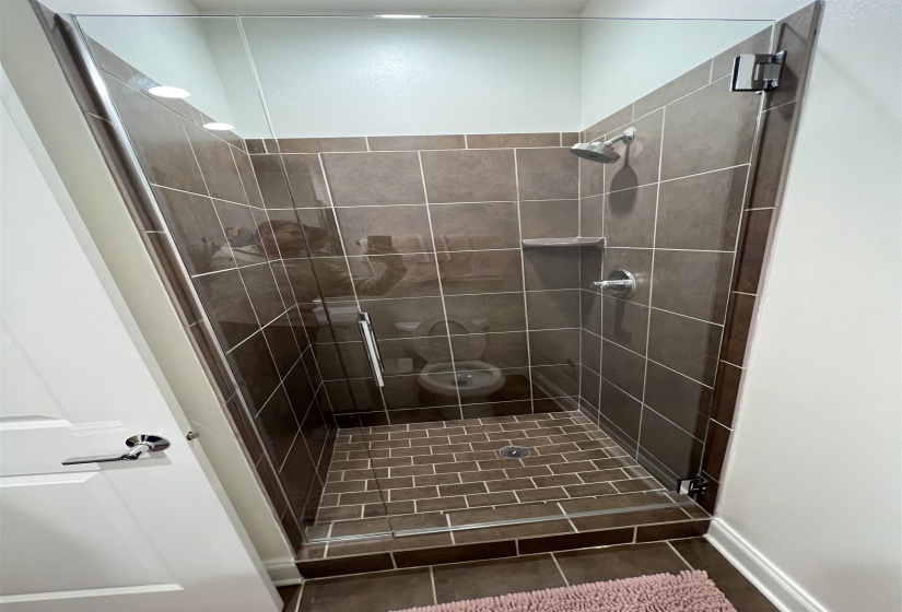 Bathroom featuring tiled shower