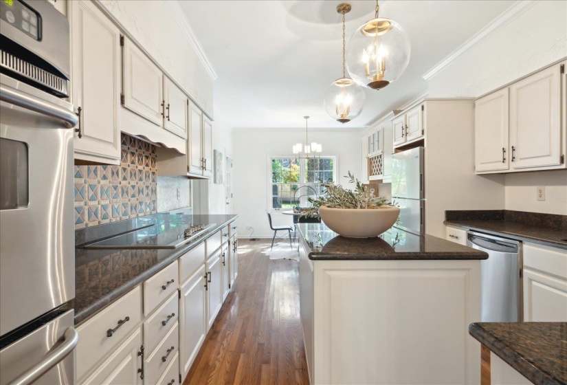 Ample cabinet space, center island and plenty of counter top makes cooking in this kitchen a joy