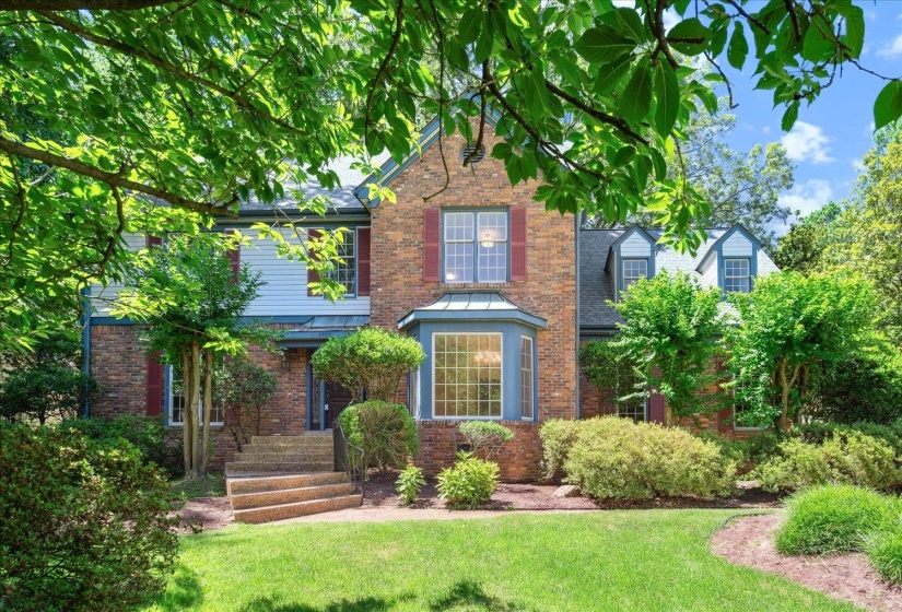 Lots of trees make the front of the home so welcoming