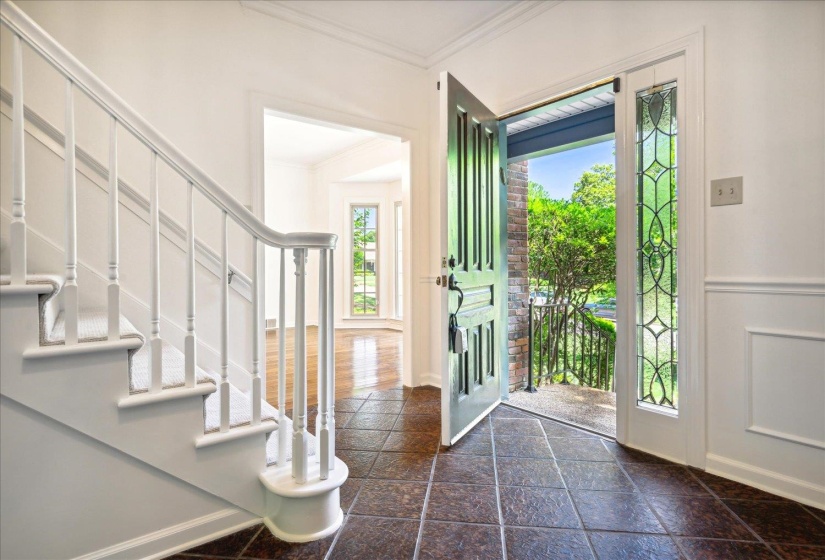 Large entry foyer leads to formal dinning, den and library
