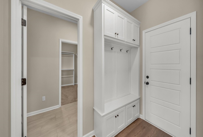 Mudroom with baseboards and light wood-style floors