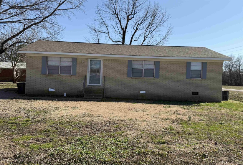 Ranch-style home with crawl space, entry steps, brick siding, and roof with shingles