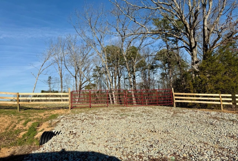 View of yard with a rural view and fence