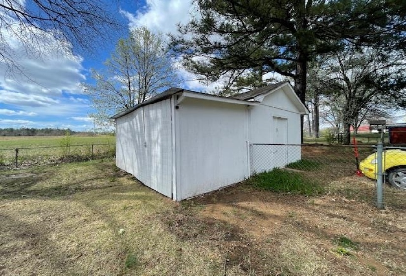View of shed with fence