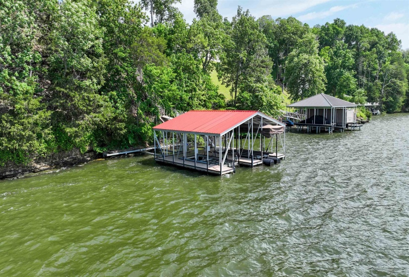 Dock area with boat lift and a water view