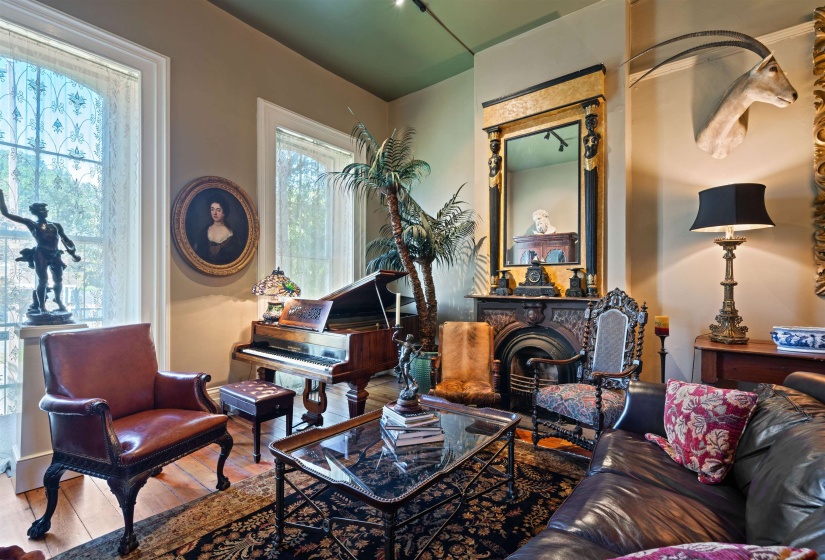 Interior space with a wealth of natural light, hardwood / wood-style flooring, and a fireplace