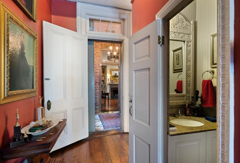 Bathroom featuring a notable chandelier, hardwood / wood-style flooring, and large vanity