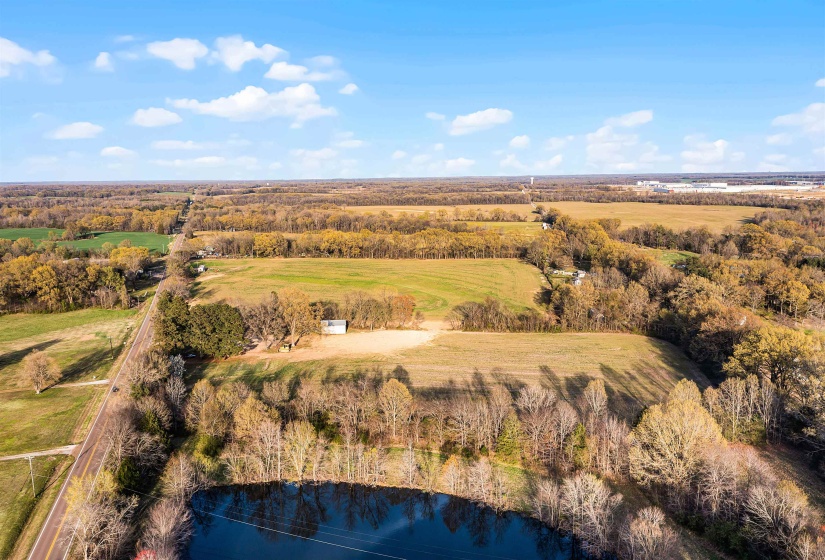 Birds eye view of property with a rural view