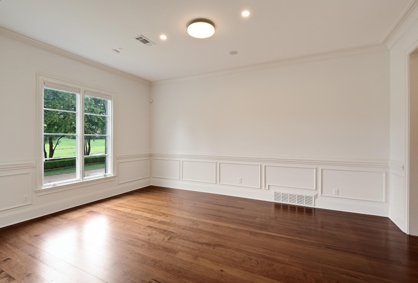 Unfurnished room featuring wood-type flooring and ornamental molding