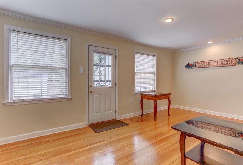 Entryway featuring crown molding, light wood finished floors, and recessed lighting