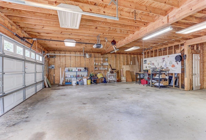Garage featuring a garage door opener