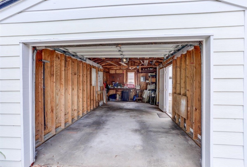 Garage featuring wooden walls