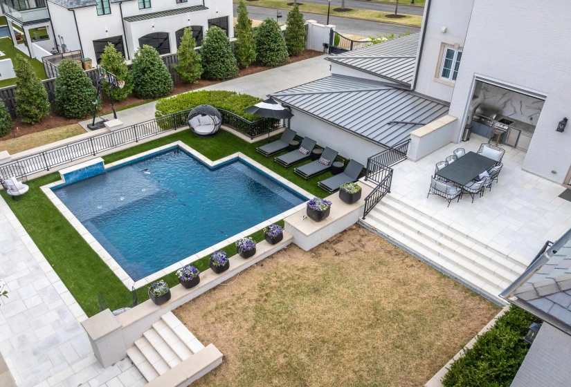 View of pool featuring a patio, fence, a fenced in pool, and a yard