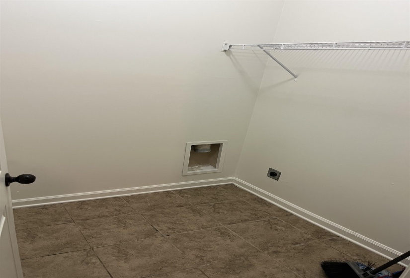 Washroom with baseboards, laundry area, and electric dryer hookup