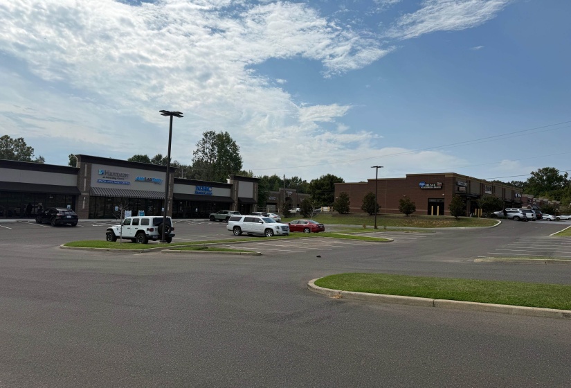 View of asphalt road featuring curbs
