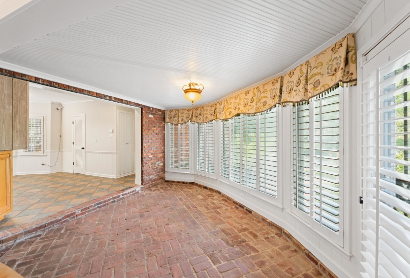 Situated between den and kitchen with full view of patio and beautiful pool