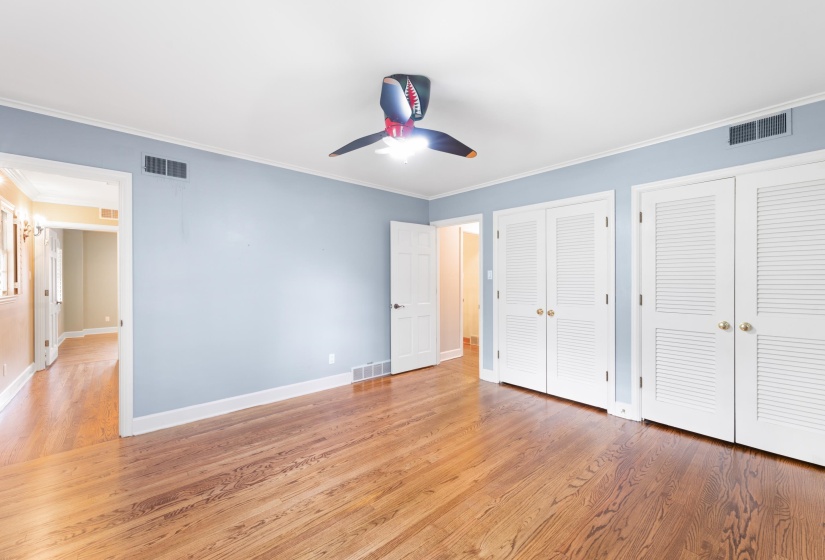 Two closets, ceiling fan, newly refinished hardwood floors and walk-in attic access