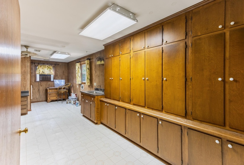 Large Pantry area with laundry, large storage closet, office space and bathroom.