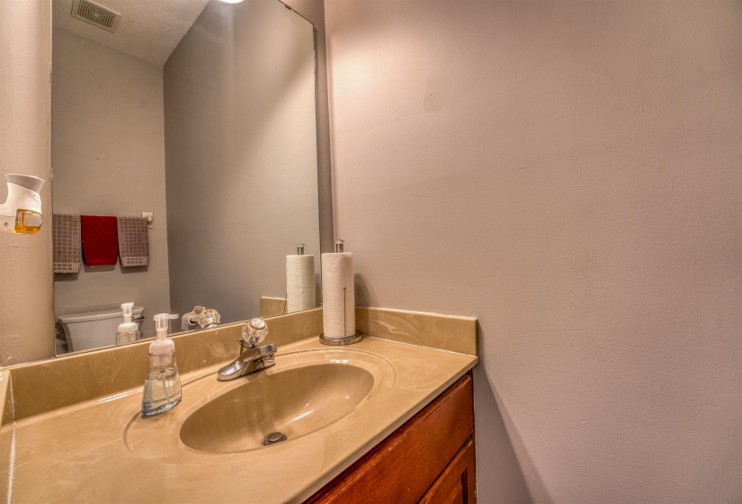 Bathroom with visible vents, toilet, and vanity
