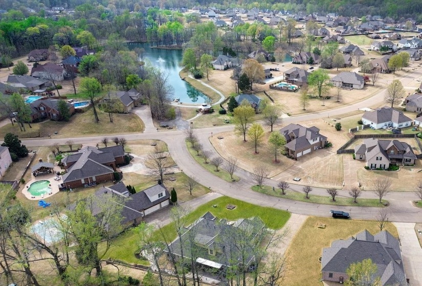 Birds eye view of property with a residential view and a water view