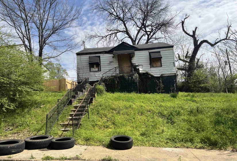 View of front facade featuring fence