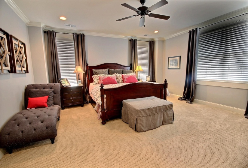 Large room with lots of windows and private balcony