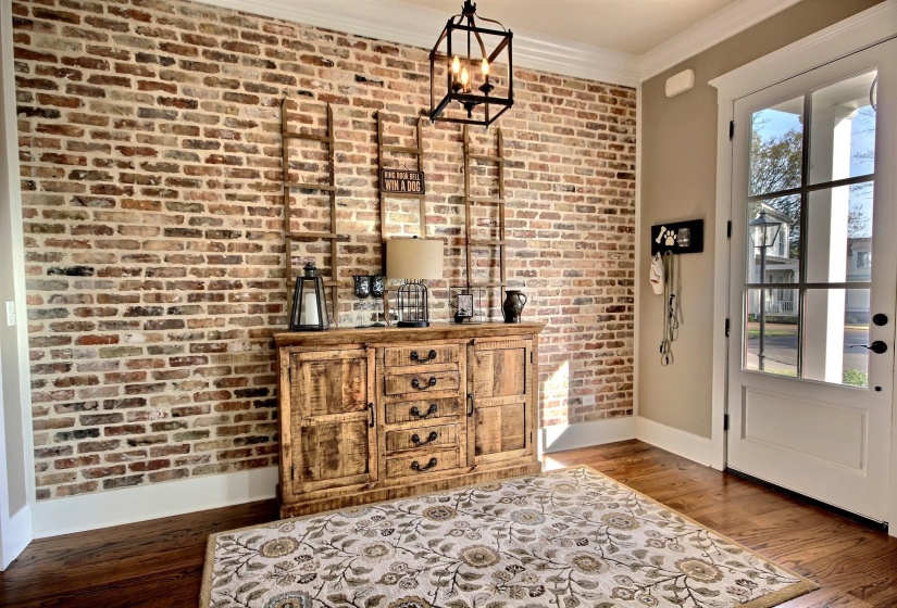 Entryway with beuatiful reclaimed brick wall