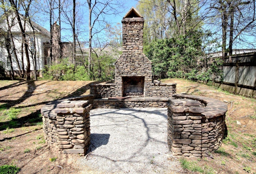 with an outdoor stone fireplace
