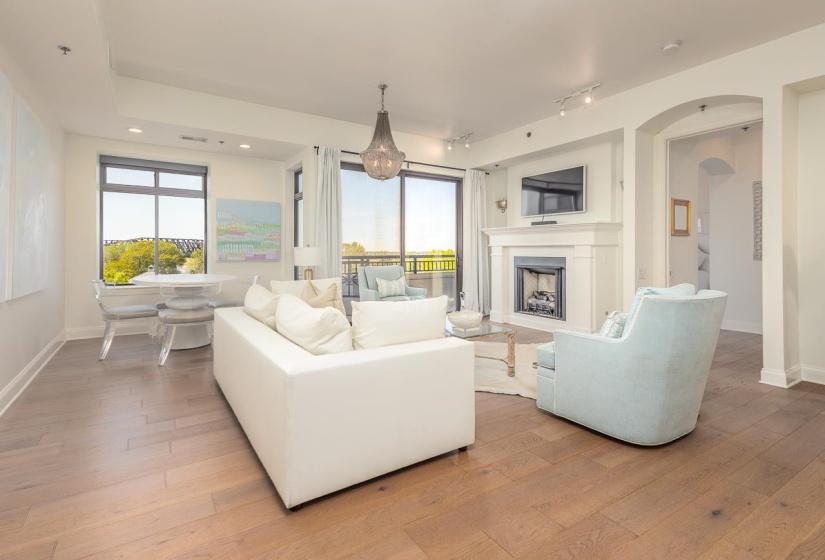 With ventless, gas log fireplace and access to private balcony.