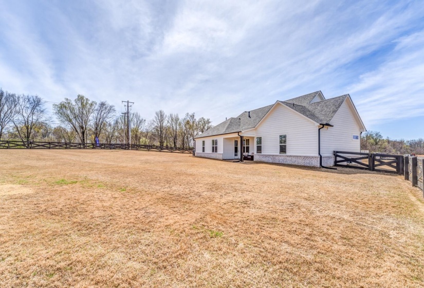 View of yard featuring fence