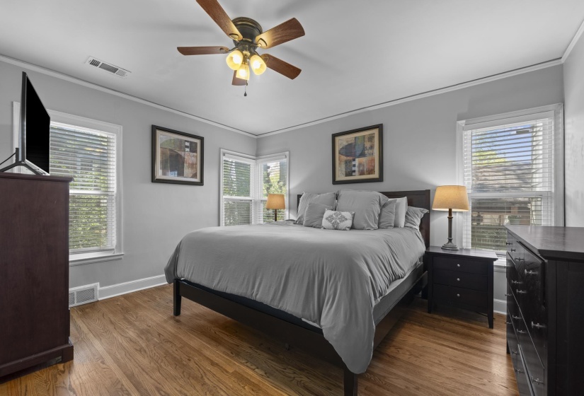 Awesome size, 4 windows, beautiful floors - this is a great primary bedroom