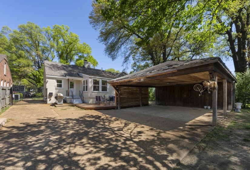 Gated and covered parking with plenty of space for two cars and a turnaround. Super convenient and secure. Still plenty of entertainment space with the deck and yardspace for the dogs!