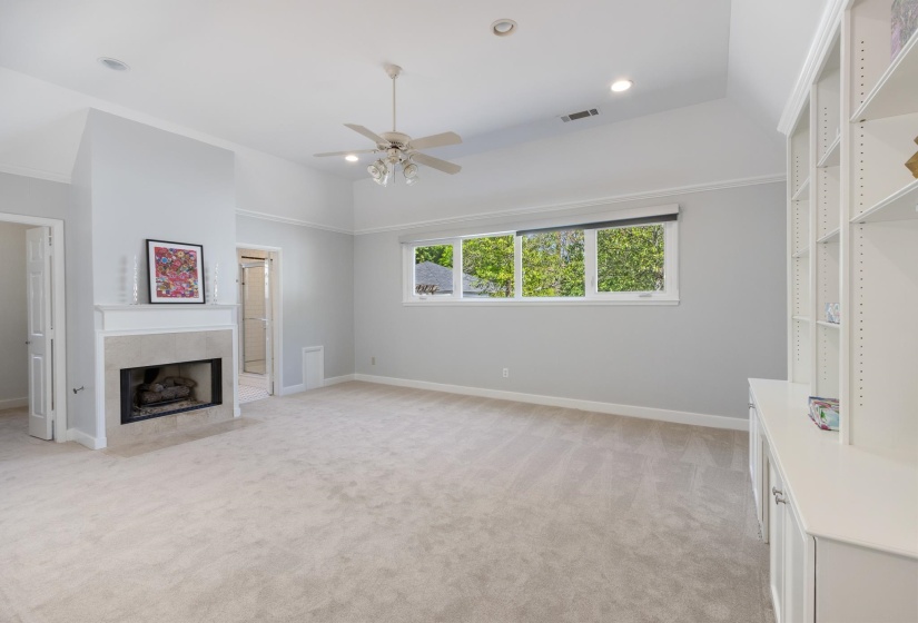 This Primary Addition is located near Back Door off Mudroom Hallway Area, just a few steps from Kitchen-separate from other bedrooms