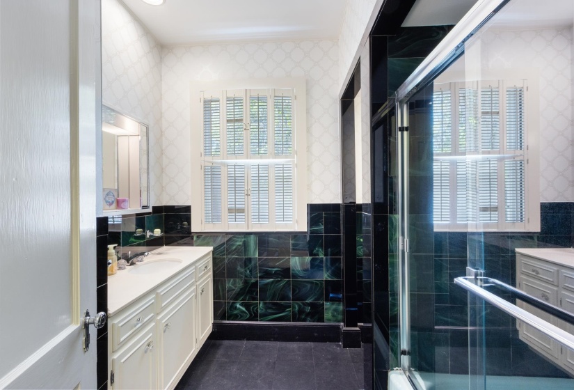 This 3rd Bath is located between Br3 and Br4, Linen Closet behind Door.