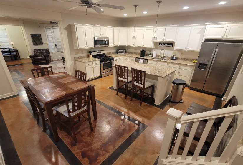 Kitchen featuring recessed lighting, white cabinetry, a ceiling fan, appliances with stainless steel finishes, and a sink