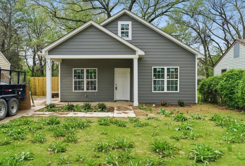 Bungalow-style house featuring a porch and fence