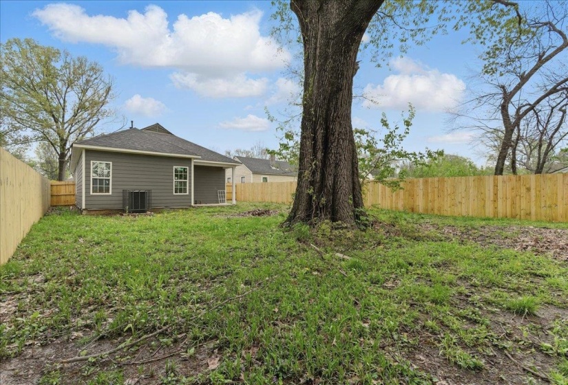 View of yard featuring cooling unit and a fenced backyard