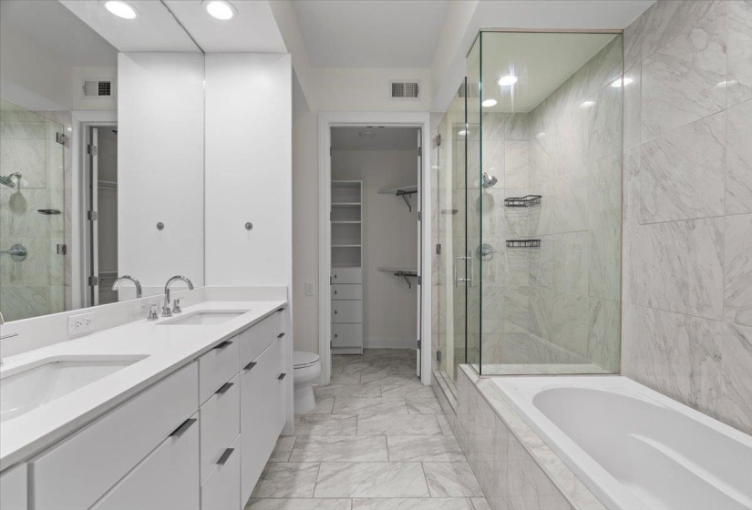 Bathroom with visible vents, marble finish floor, and a stall shower