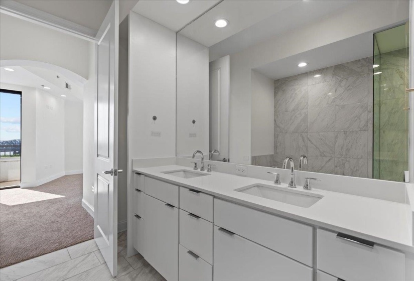 Full bathroom featuring a sink, baseboards, and recessed lighting