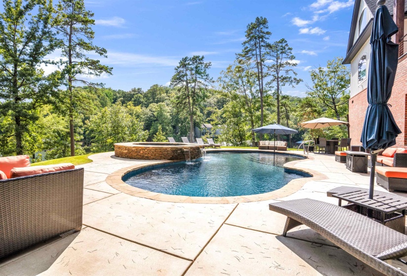 View of swimming pool featuring a patio, an outdoor living space, and a pool with connected hot tub