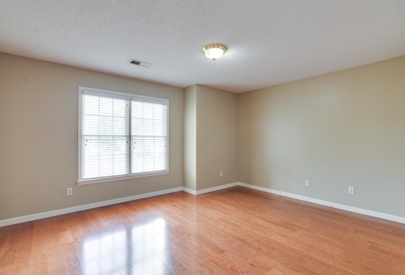 Bedroom featuring a textured ceiling and light wood-type flooring