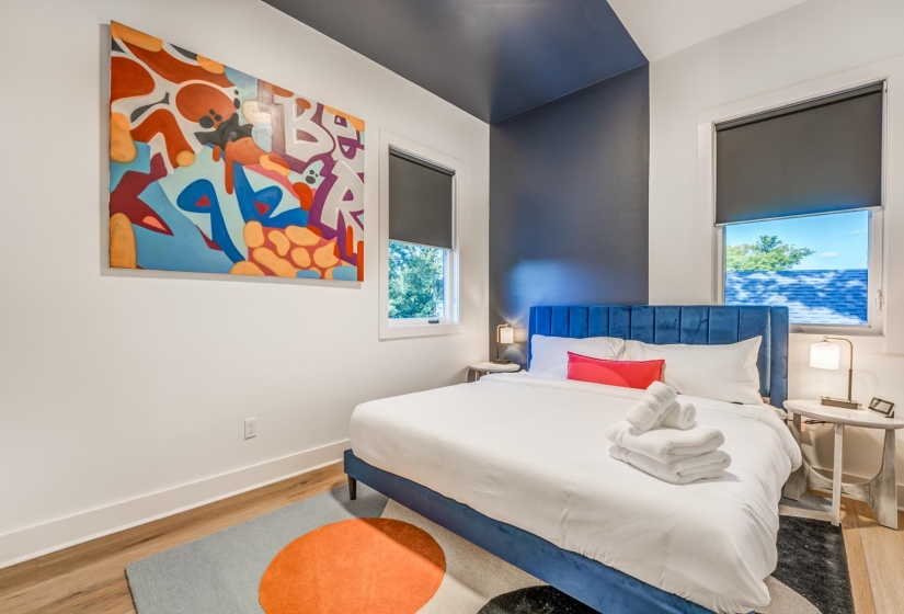 Bedroom featuring baseboards and wood finished floors